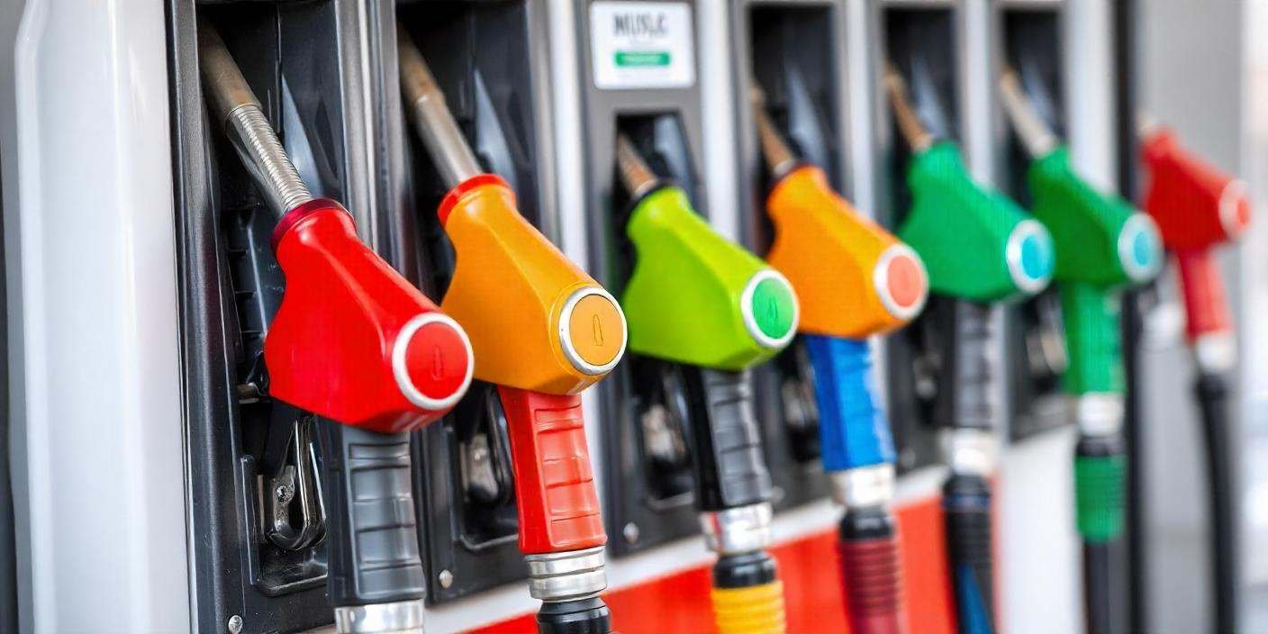 The petrol dispensers are clearly visible with colorful fuel nozzles