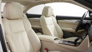 half white Cadillac CTS front seates interior 2026
